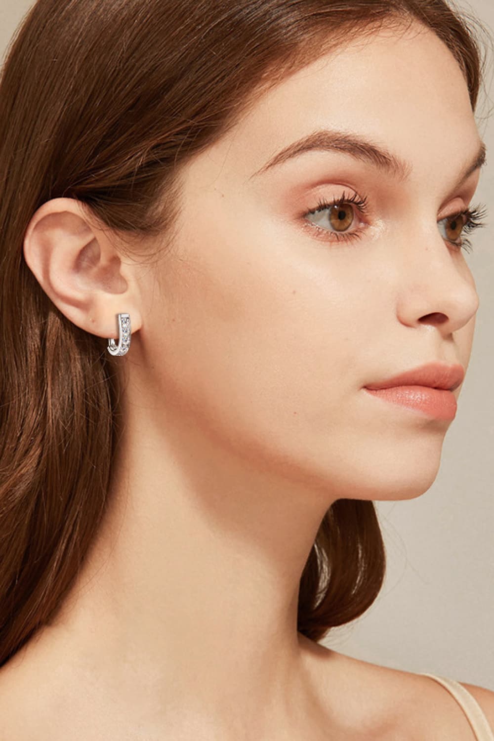 Side profile of model wearing Elegant Moissanite Earrings for a sophisticated look.