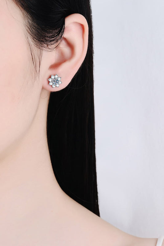 Floral Moissanite Stud Earrings worn on ear for size reference