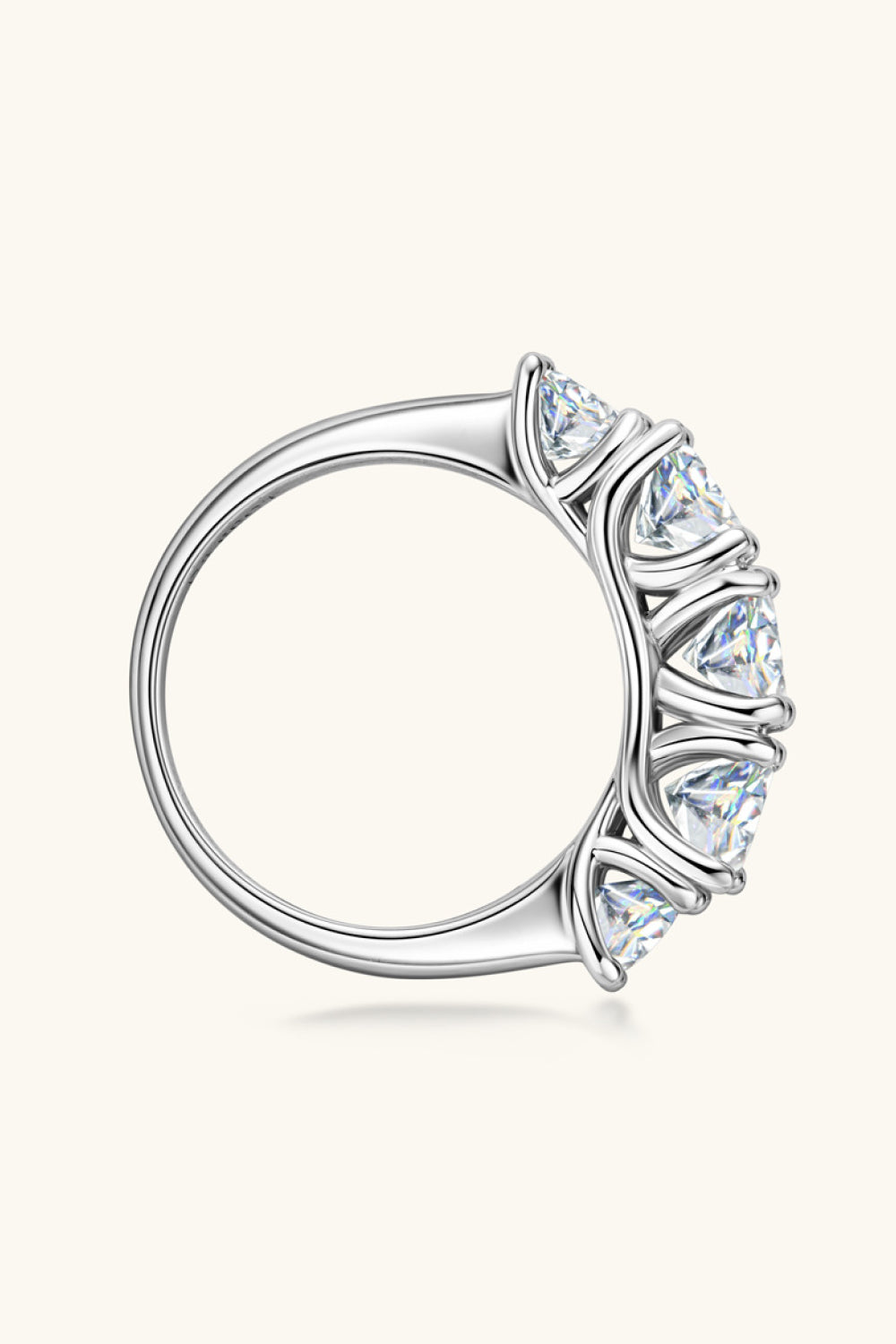 Side profile of the half eternity Moissanite Ring showing prong setting